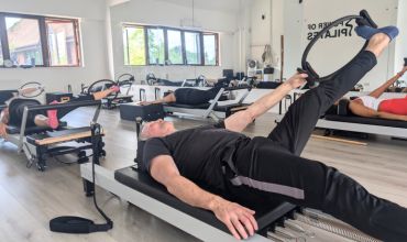 reformer stretch with Pilates circle